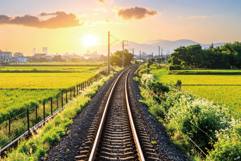 One of Japans train tracks that looks out onto the horizon with views of the city