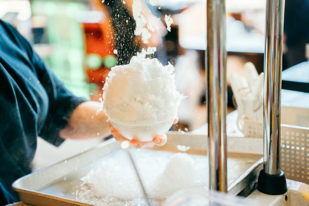 The process of the kakigori ice shavings, soon to be paired with homemade sweet syrups