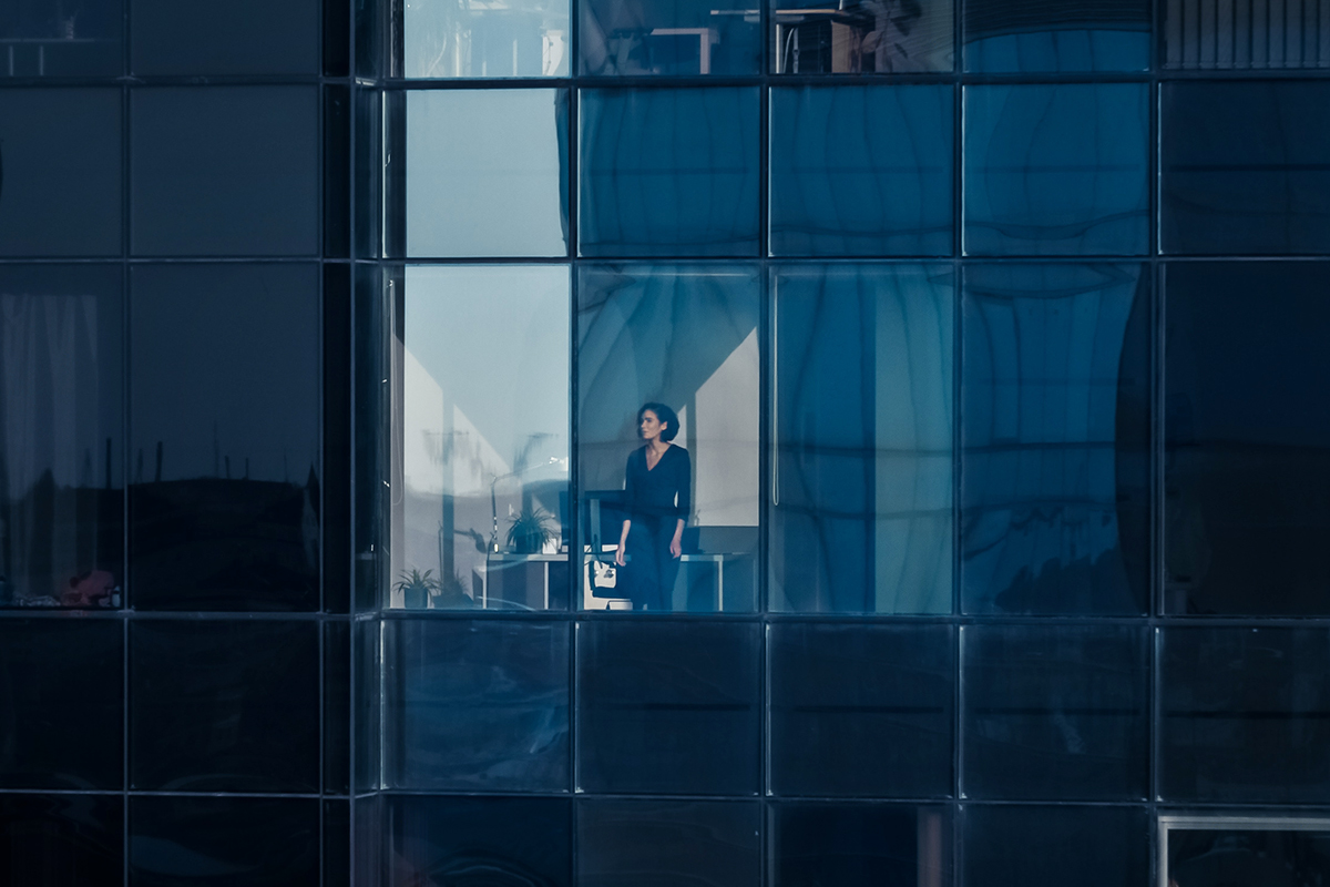 Aerial Shot from the Outside Into Office Building featuring a female Business Leader