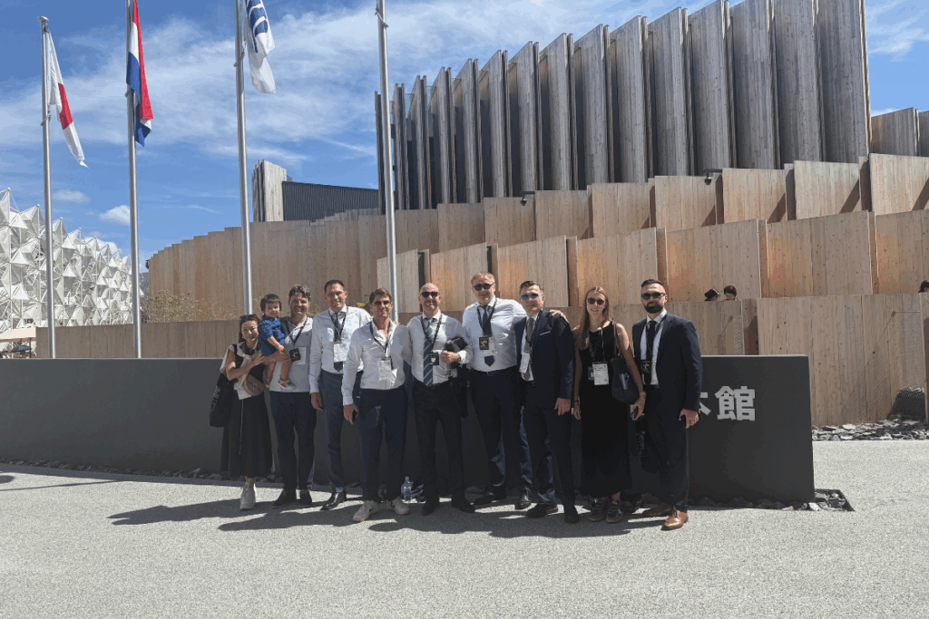 The Japan Pavilion welcomes visitors with its wooden lattice design symbolizing the fusion of tradition and technology.