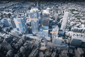 Aerial view of Shibuya Station’s redevelopment area in Tokyo with modern skyscrapers.
