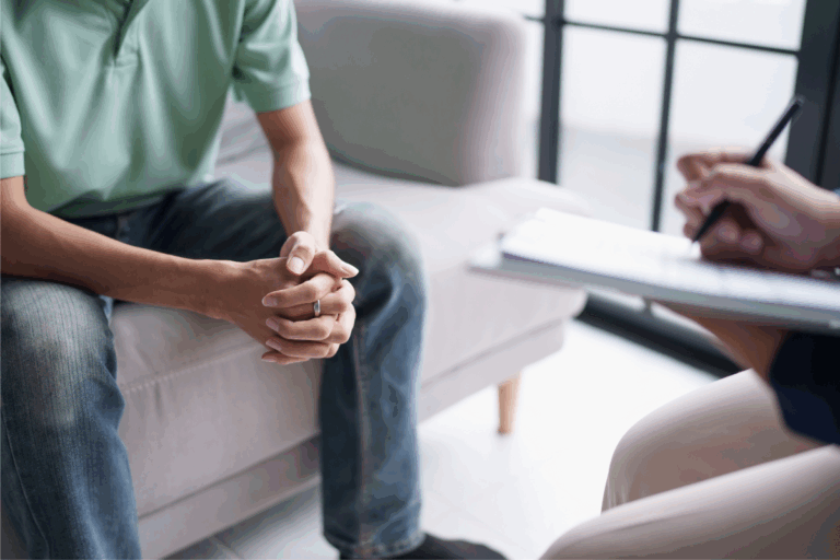 Therapist talking with a patient during a counseling session, representing the discussion on how AI could support mental health care.