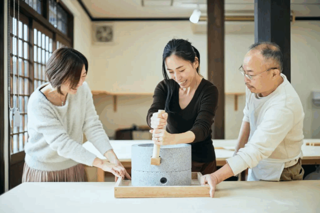 Scenes from Kinosaki Onsen in autumn showcasing its hot springs, cultural workshops, outdoor adventures, and tranquil scenery.