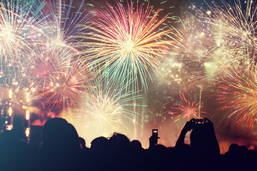 Cheering crowd and fireworks - New Years Celebration