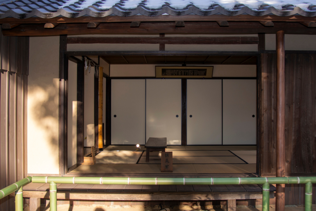 A cozy Japanese café street scene representing the idea of a community third place.
