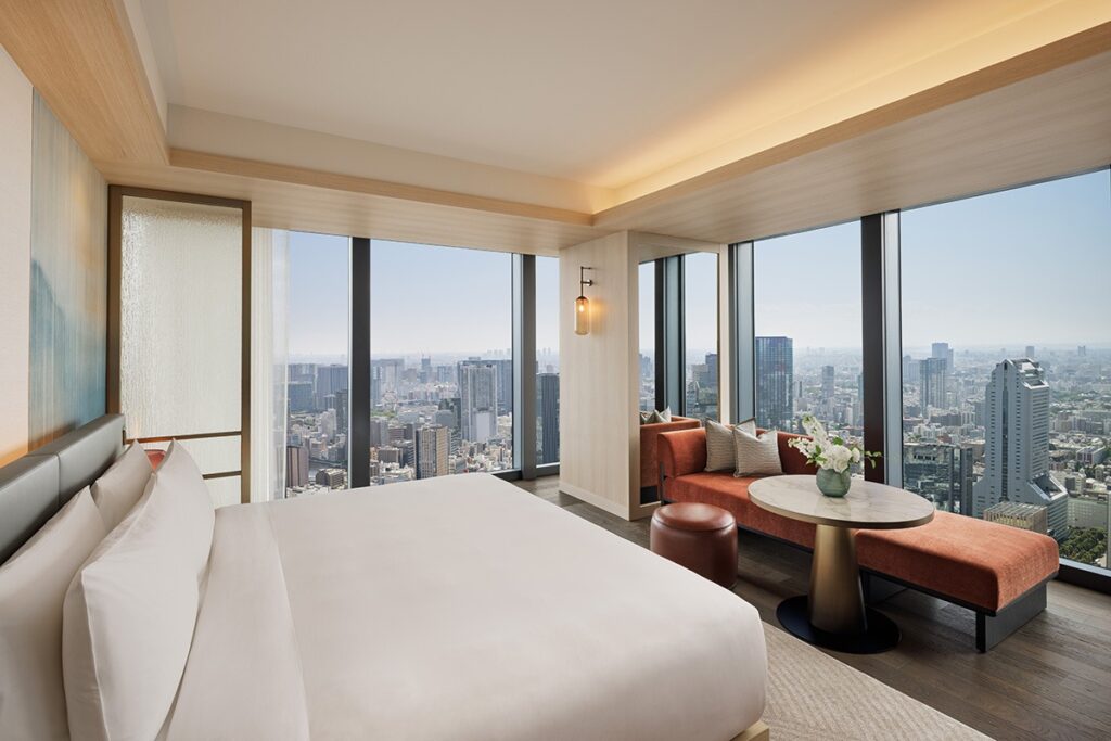 Fairmont Tokyo suite bedroom with surrounding views of the Tokyo skyline highlight luxury hospitality in Japan