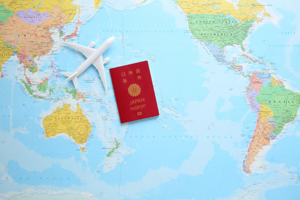 Japanese passport for travel on world map
