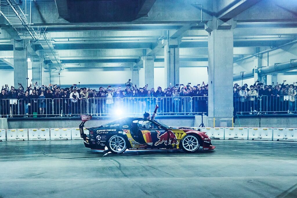 The warehouse setting with fans cheering