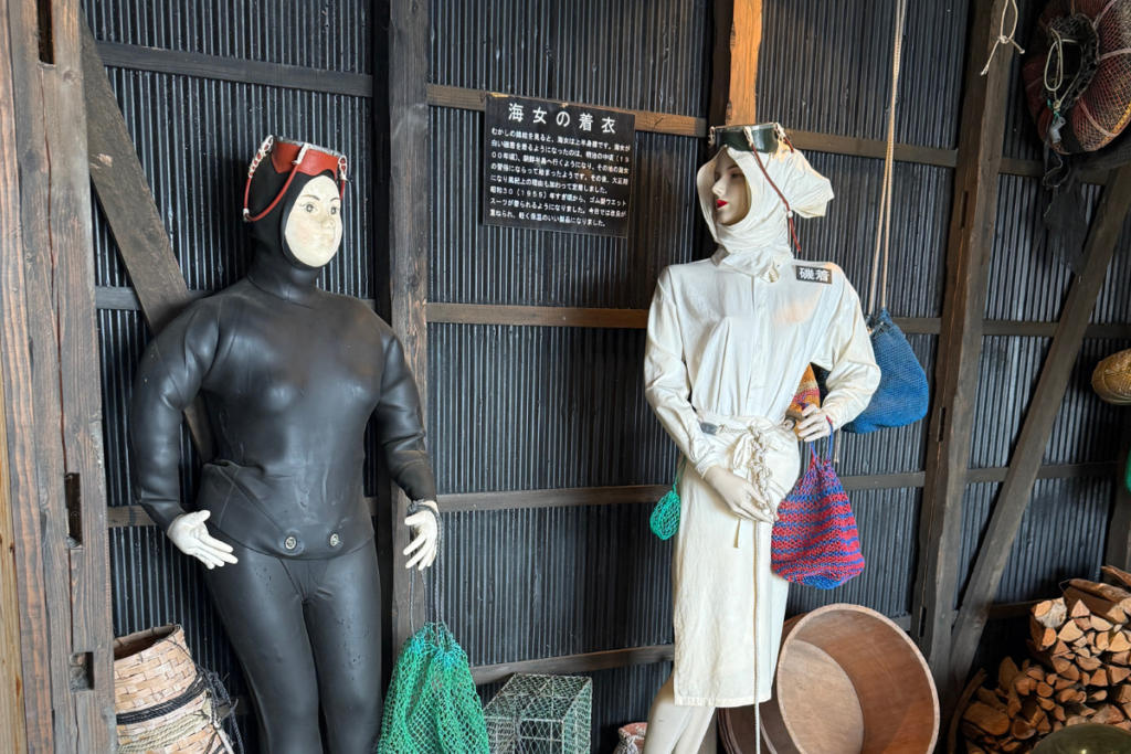 Female Ama divers in traditional white diving outfits in Mie Prefecture.