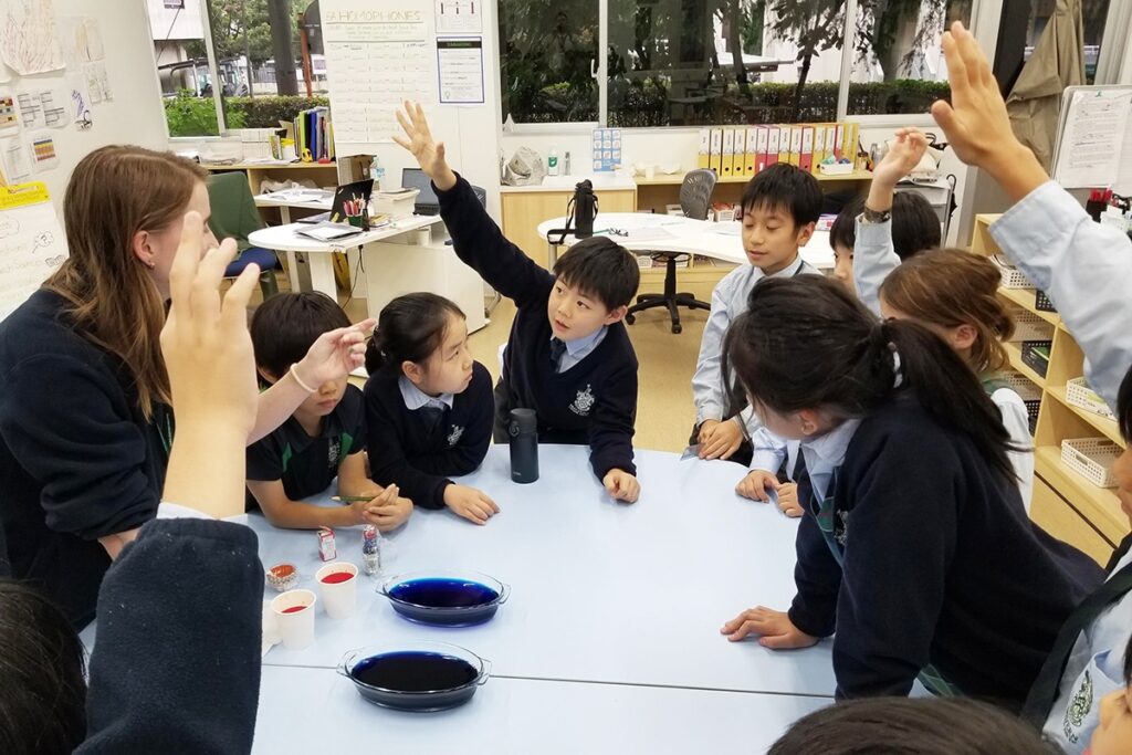 Kids actively participating in classroom at Malvern College Tokyo