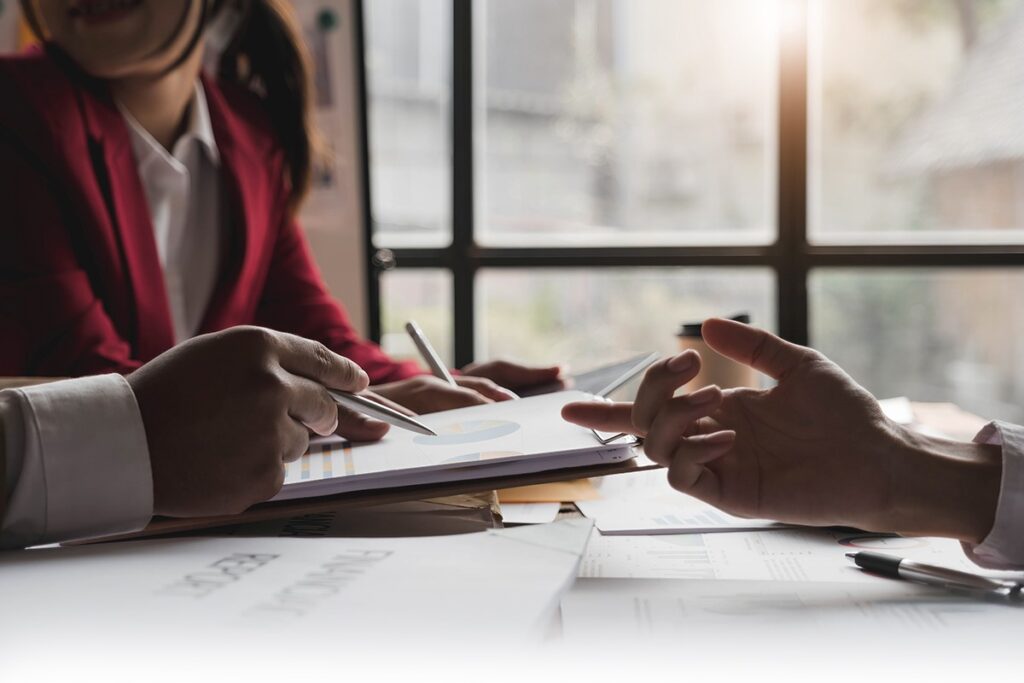 investor checking tax documents with advisor