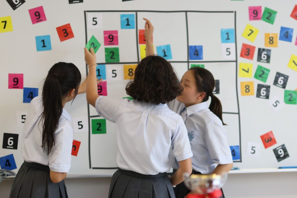 Student arranging numbers