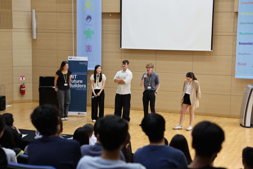 Students speaking in front of an audiance