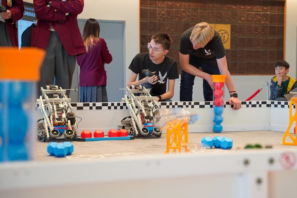 Canadian Academy students operating robots