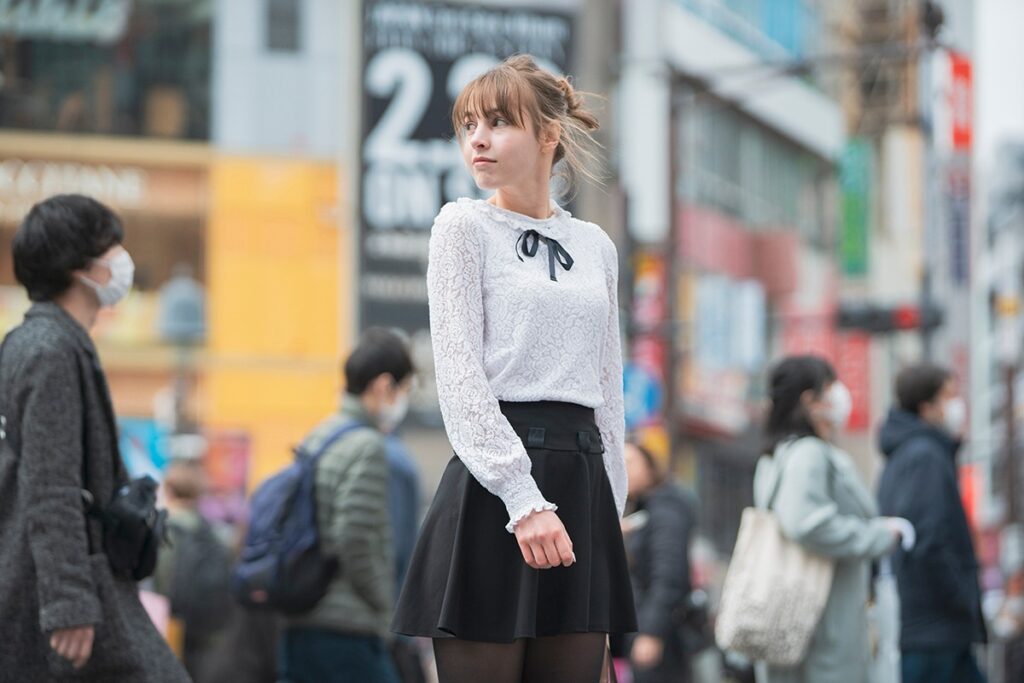 Woman in white blouse and black skirt in Japan