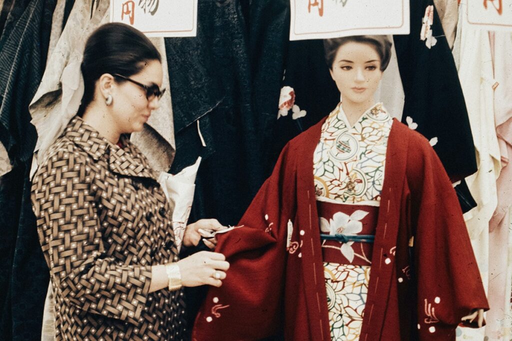 Woman looking at a kimono price tag