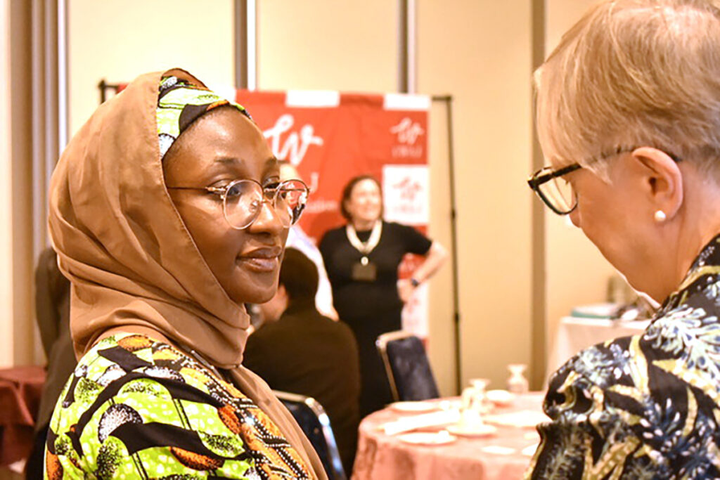 Dr Hafsat Usman networking at CWAJ event