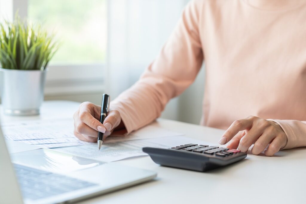 woman calculating costs of owning property in Japan