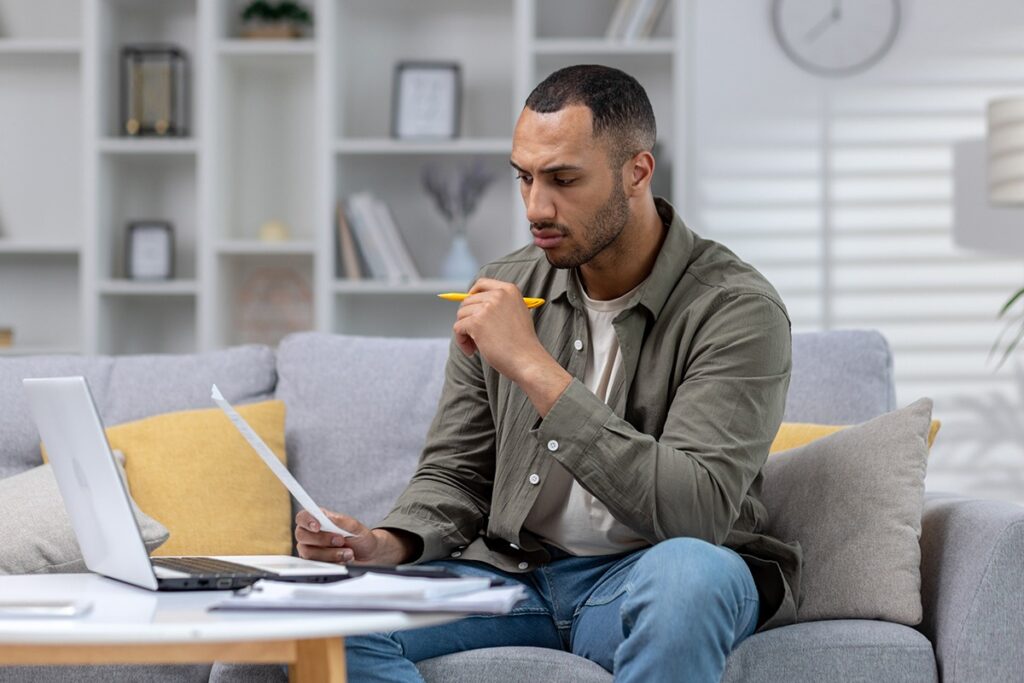 Man reviewing Business Manager Visa documents
