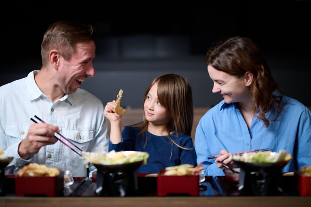 Family enjoying Japanese-style meal 