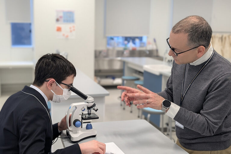 Laurus teacher guides a STEM student