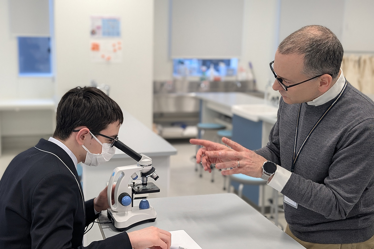Laurus teacher guides a STEM student