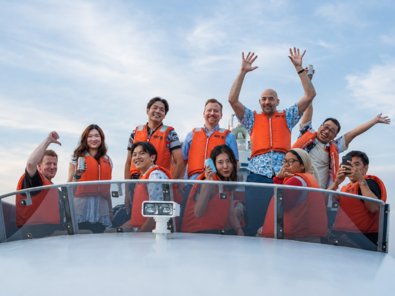 GoConnect team enjoying a boat outing in Tokyo, reflecting Japan’s diverse international community.