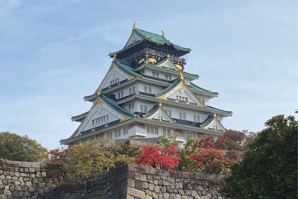 A traditional Japanese castle against a cloudy sky