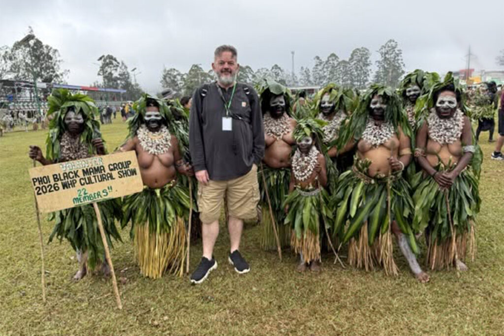 Simon Farrell in Papua New Guinea with locals